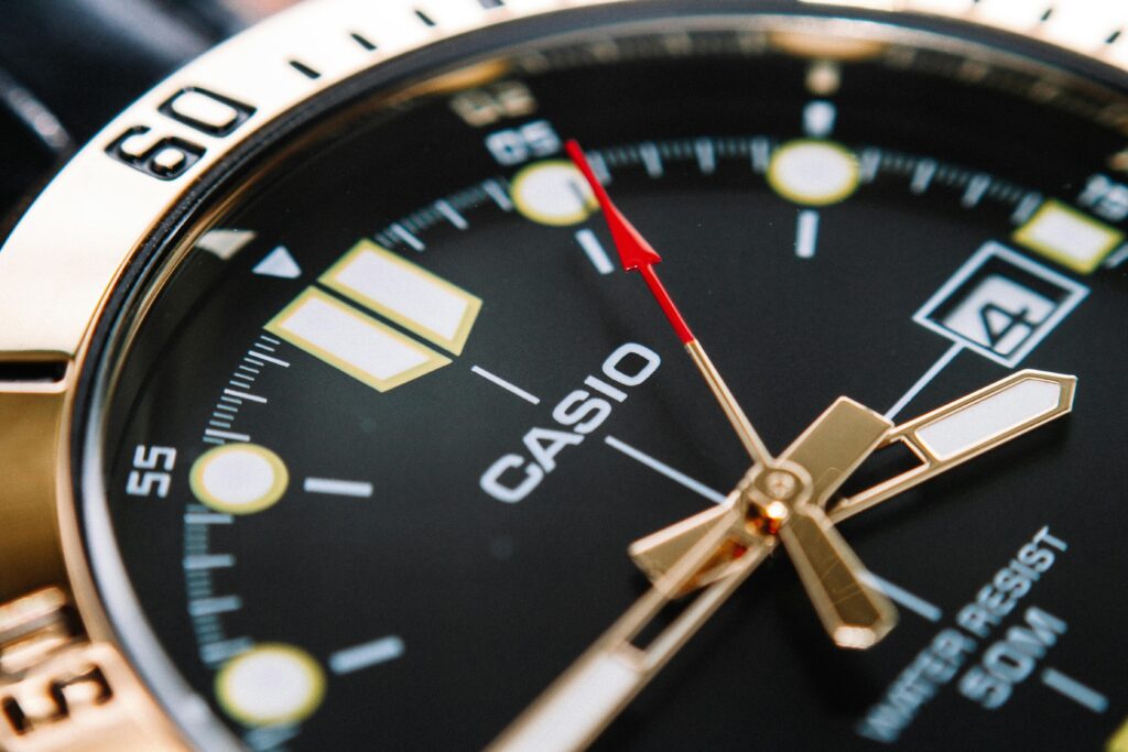 Detailed shot of a classic analog wristwatch face highlighting precision and design.